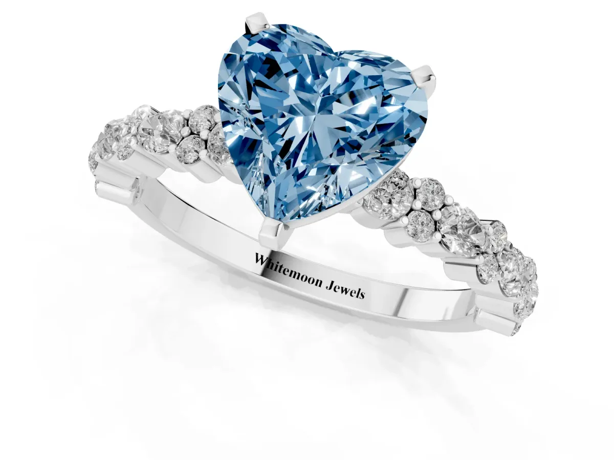 Fancy Blue Heart Cut Diamond Side Stone Solitaire Ring with Round and Four-Prong Setting Silver