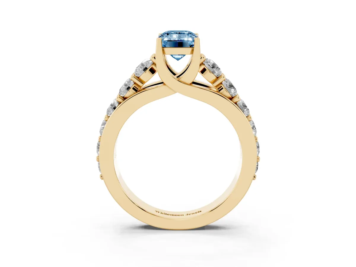 Fancy Blue Emerald Cut Diamond Engagement Ring with Pavé Band and Four-Prong Setting Yellow gold