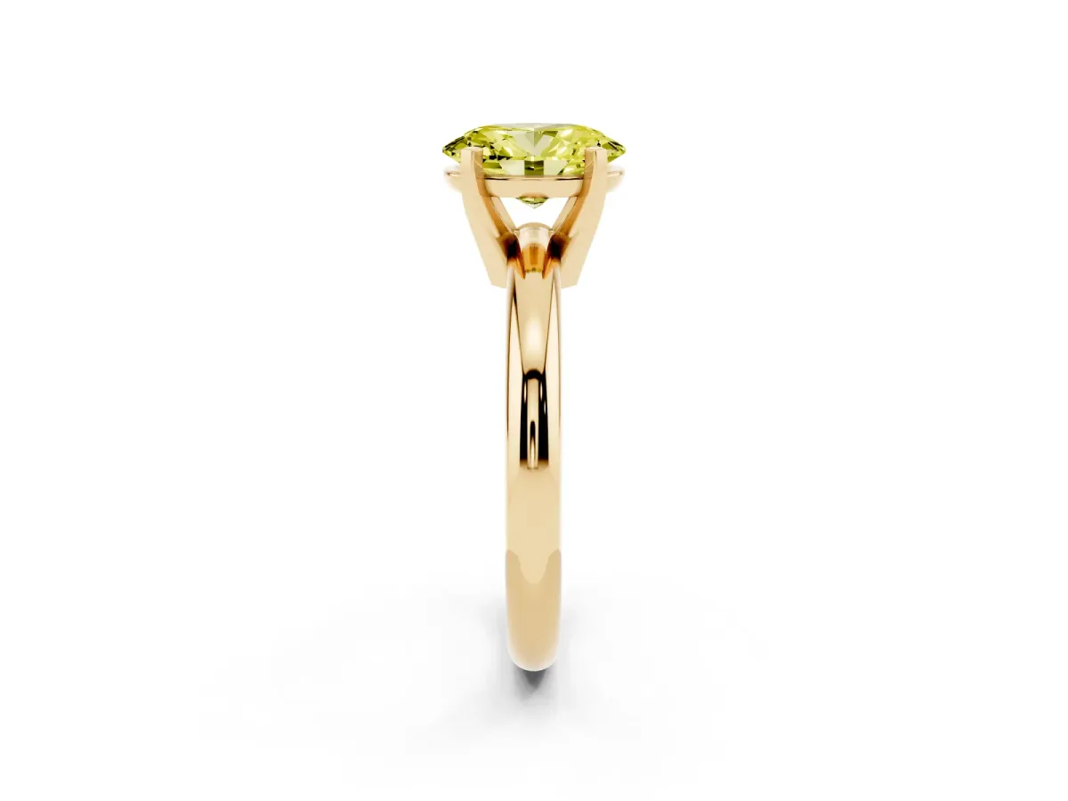 Fancy Yellow Oval Cut Diamond Solitaire Engagement Ring with Round Band and Four-Prong Setting Yellow gold