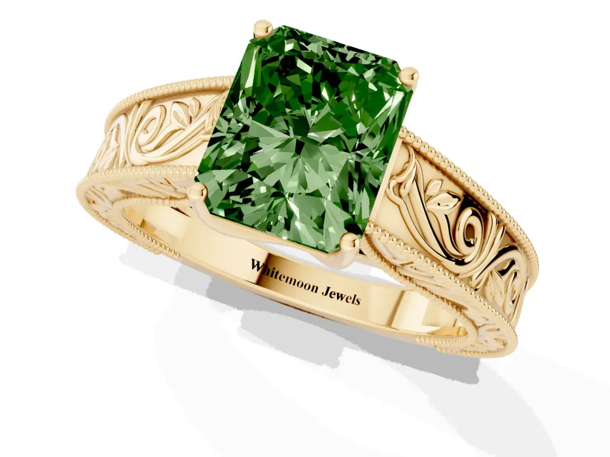 Fancy Green Radiant Cut Diamond Solitaire Ring with Engraved Band and Four-Prong Setting Yellow gold