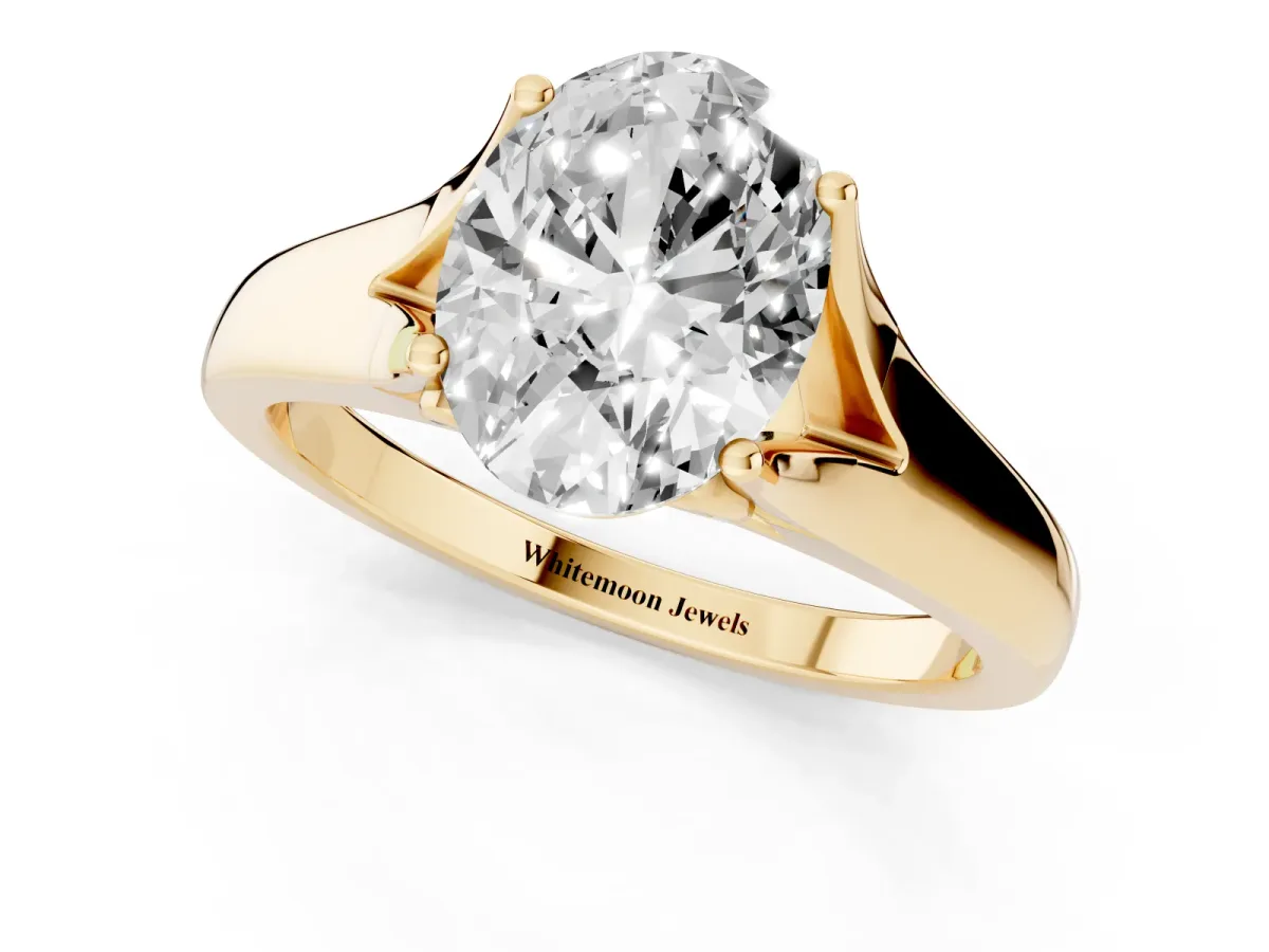 Oval Cut Solitaire Diamond Ring with Cathedral Band and Four-Prong Setting Yellow gold