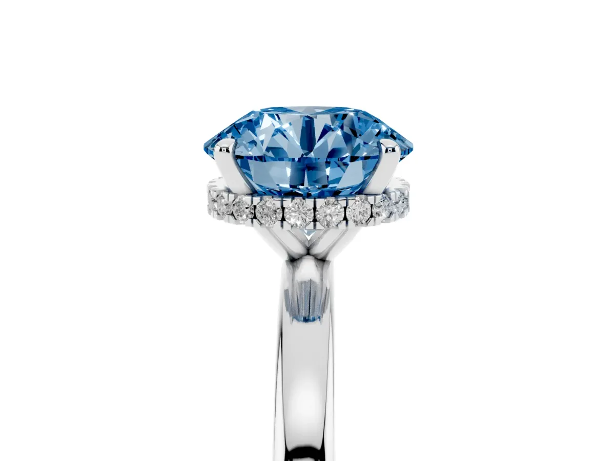 Fancy Blue Round Cut Solitaire Engagement Ring with Cathedral Band and Four-Prong Setting Silver