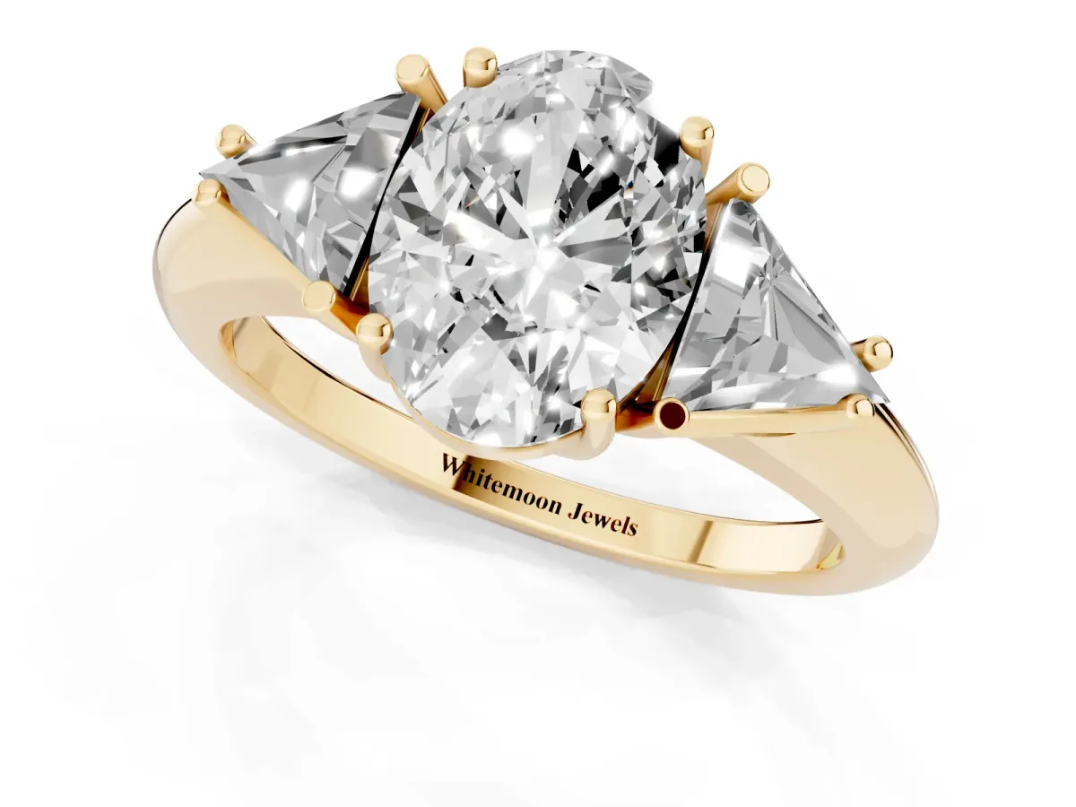 Three-Stone Oval Cut Diamond Engagement Ring with Trillion Side Stones and Prong Setting Yellow gold
