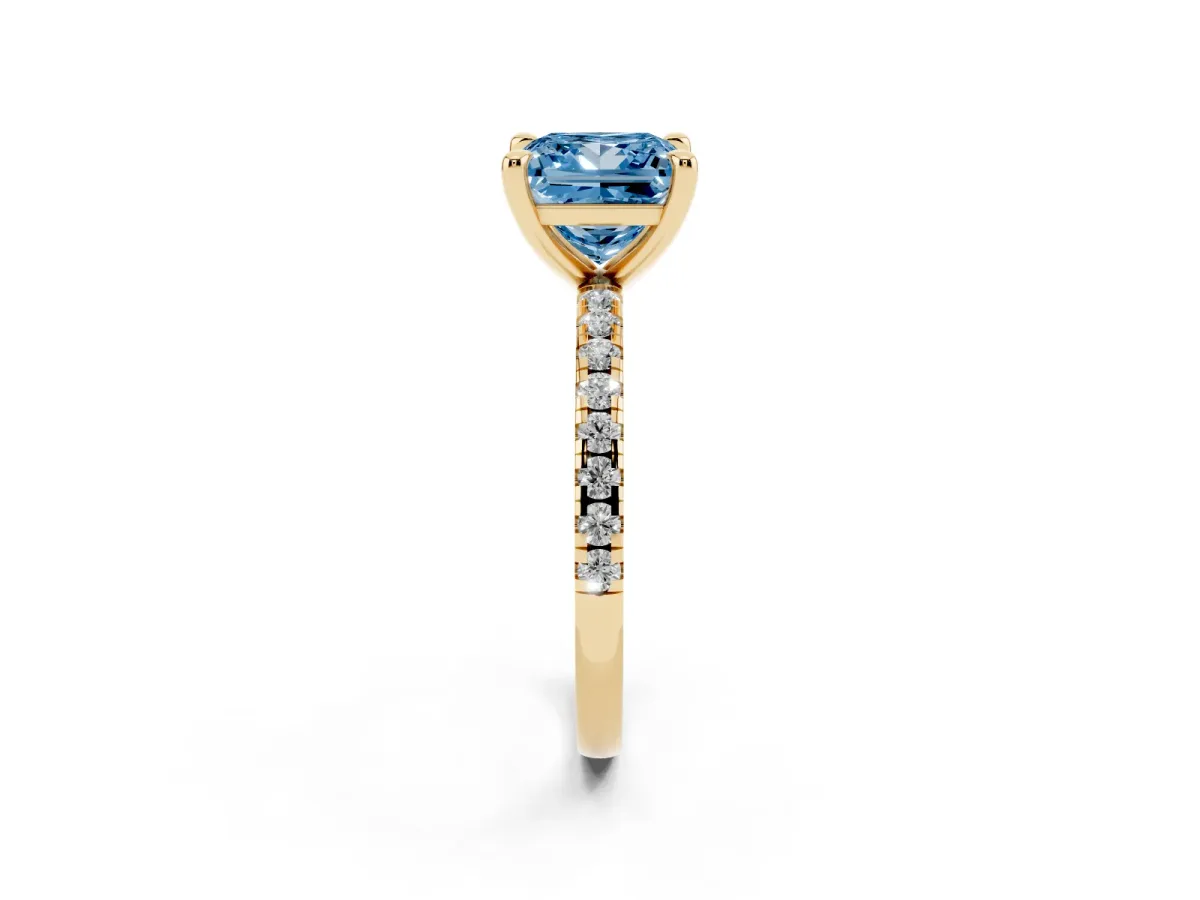 Fancy Blue Princess Cut Diamond Brilliant Solitaire Ring with Pavé Band and Four-Prong Setting Yellow gold