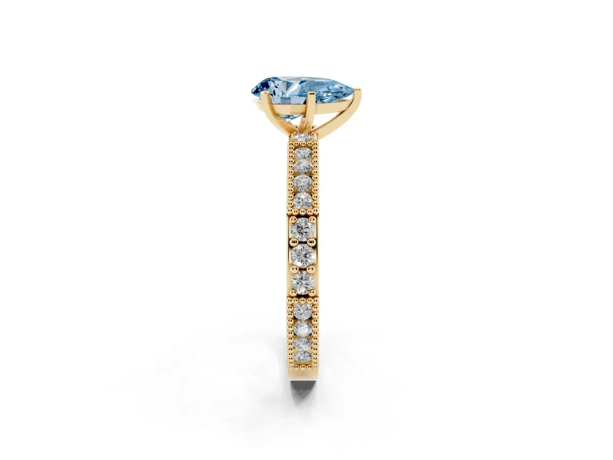 Fancy Blue Pear Cut Solitaire with Pavé Band and Four-Prong Setting Yellow gold