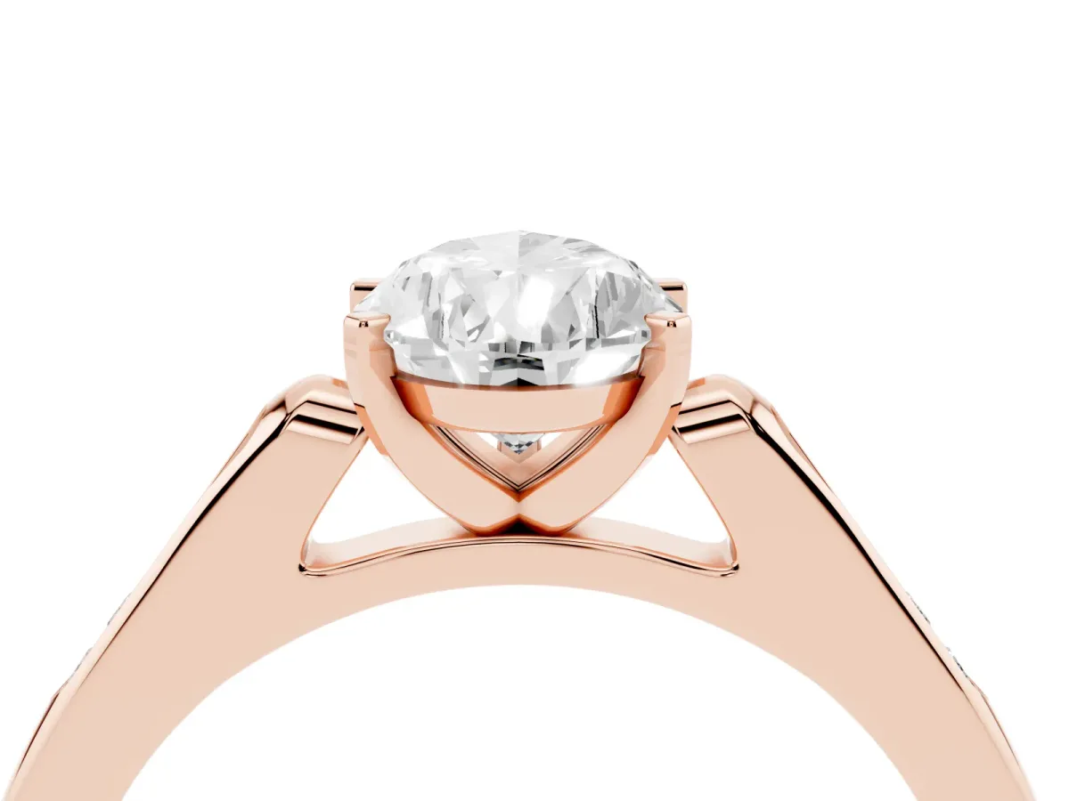 Pear Cut Diamond Solitaire Ring with Channel Set Round Band and Prong Setting Rose gold
