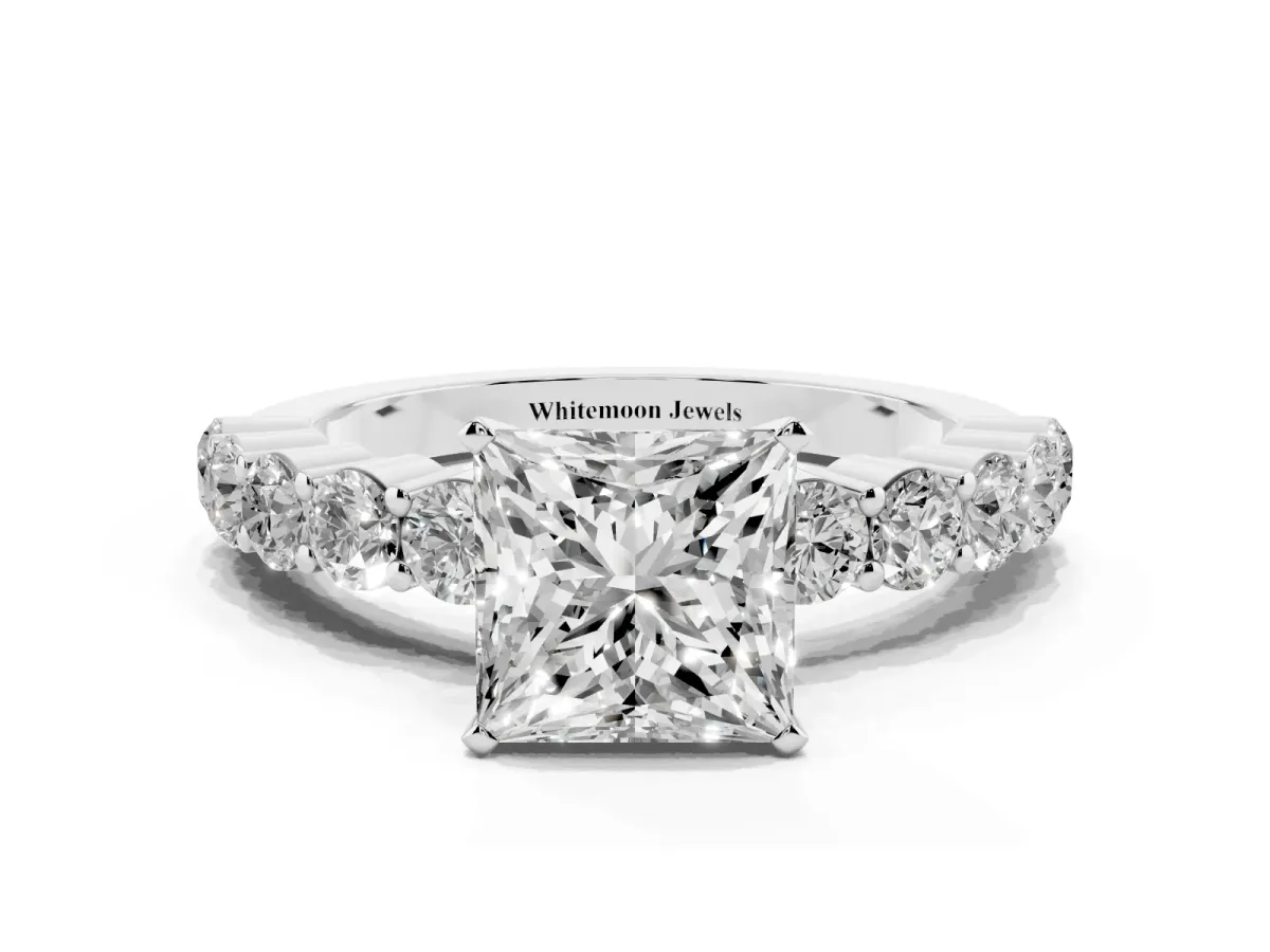 Princess Cut Diamond Solitaire Ring with Shared Prong Round Side Stones Silver