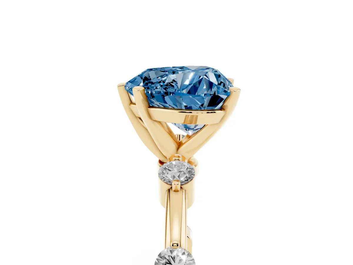 Fancy Blue Heart Cut Solitaire Diamond Ring with Bezel Set Side Stones and Prong Setting Yellow gold
