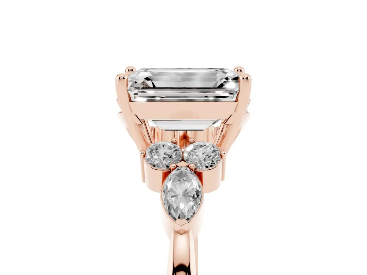 Emerald Cut Brilliant Diamond Solitaire Ring with Pear Side Stones and Four-Prong Setting Rose gold