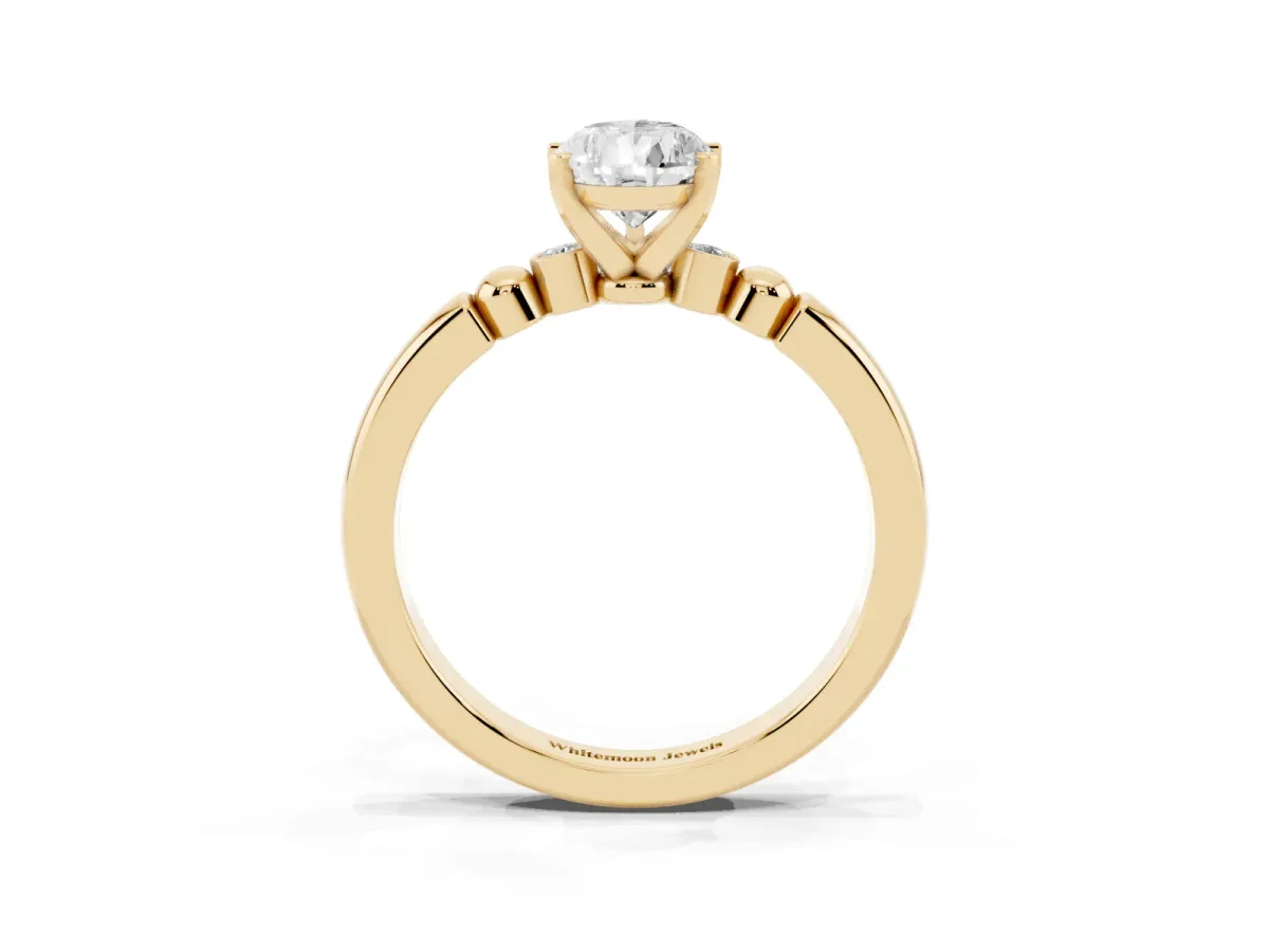 Pear Cut Solitaire Beaded Band with Four-Prong Setting Yellow gold
