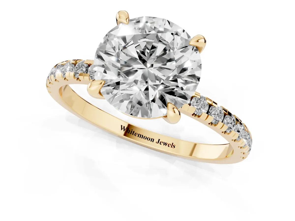 Round Cut Diamond Brilliant Solitaire Ring with Pavé Band and Four-Prong Setting Yellow gold