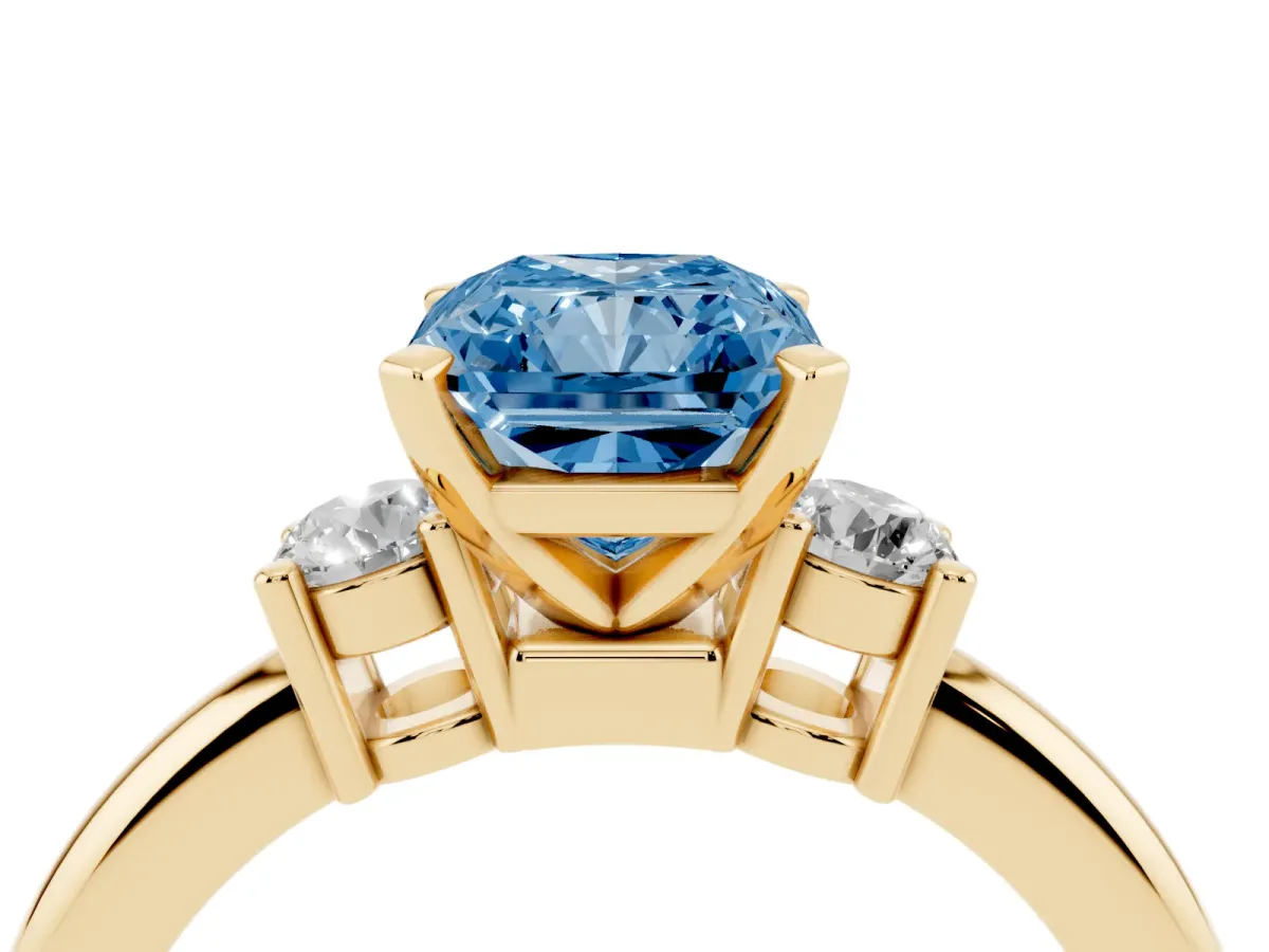 Fancy Blue Three-Stone Radiant Cut Cut Diamond Solitaire with Prong Setting and Classic Band Yellow gold