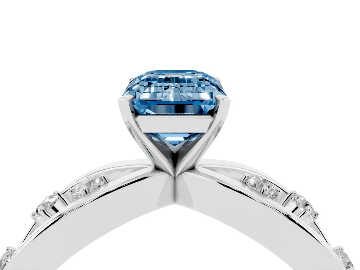 Fancy Blue Emerald Cut Cut Solitaire Diamond with Side Stones on Criss-Cross Band and Four-Prong Setting Platinum