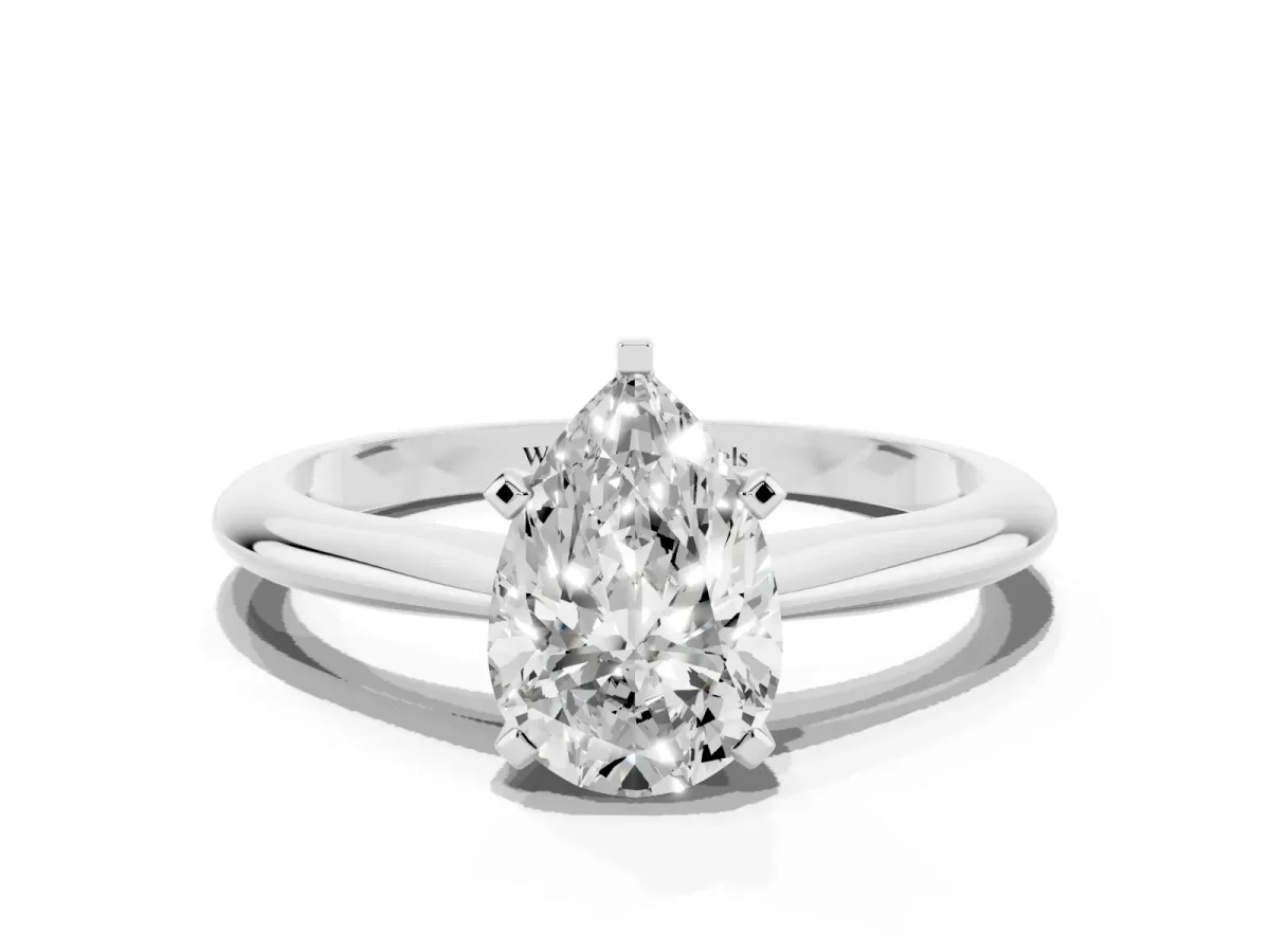 Pear Cut Cut Solitaire Ring with Four-Prong Setting on a Classic Band Silver