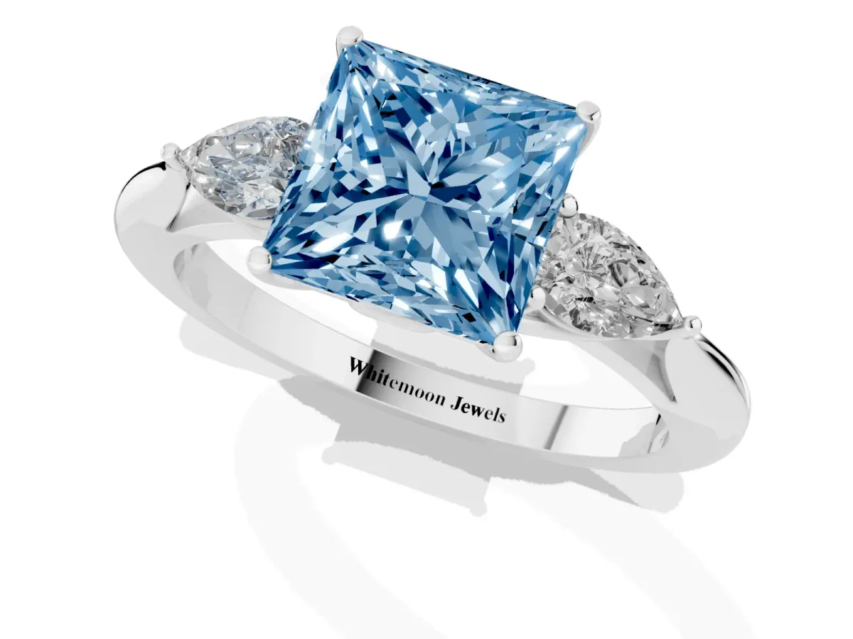 Fancy Blue Princess Cut Diamond Three-Stone Ring with Pear Side Stones and Prong Setting Silver
