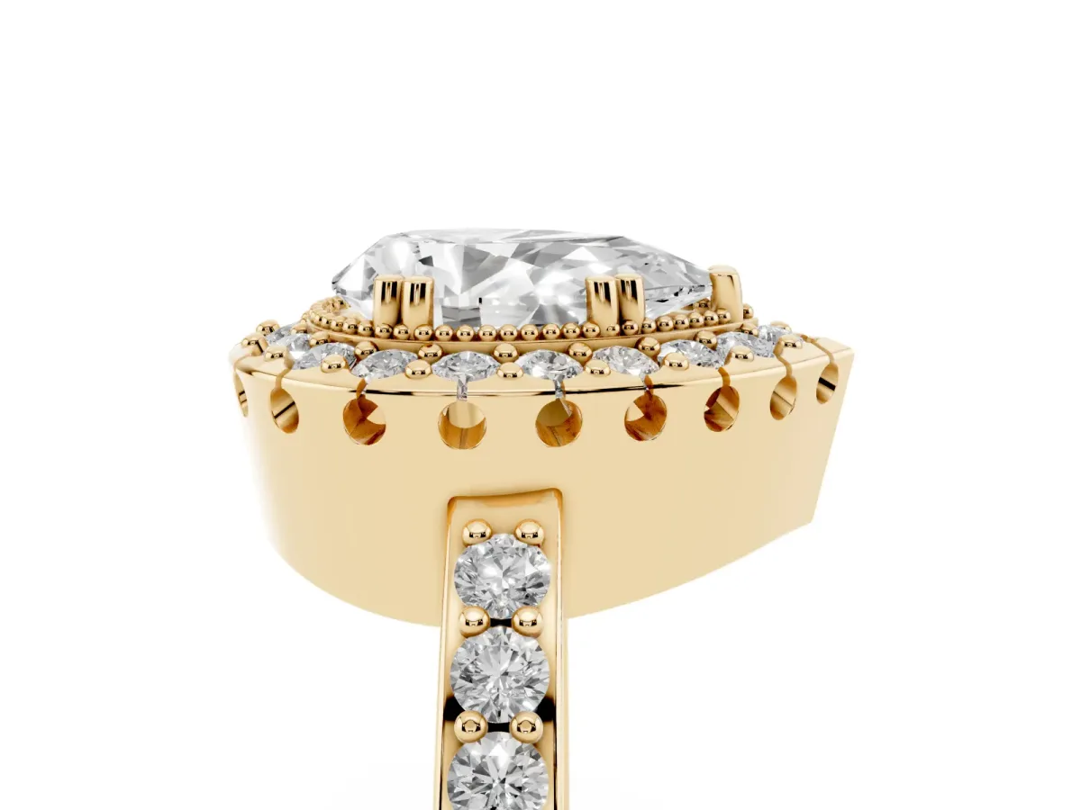Pear Cut Diamond Halo Ring with Pavé Band and Prong Setting Yellow gold