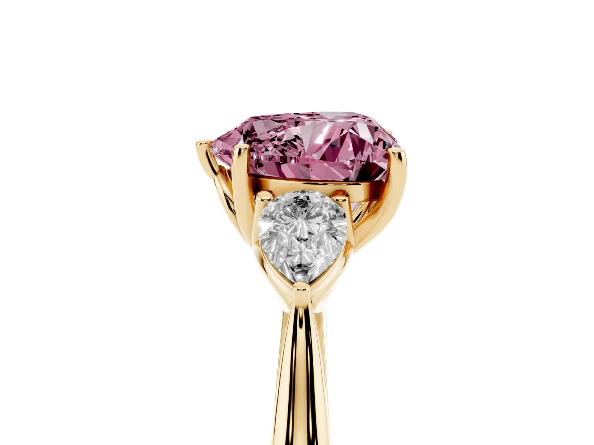 Fancy Pink Heart Cut Diamond Three-Stone Ring with Pear Side Stones and Prong Setting Yellow gold