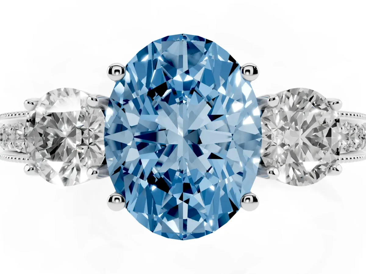 Fancy Blue Oval Cut Three-Stone Diamond Ring with Pavé Band and Four-Prong Setting Platinum