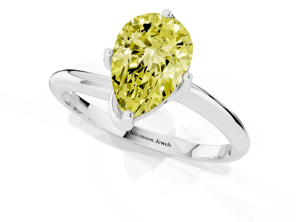 Fancy Yellow Pear Cut Diamond Solitaire Engagement Ring with Four-Prong Setting and Classic Band Silver
