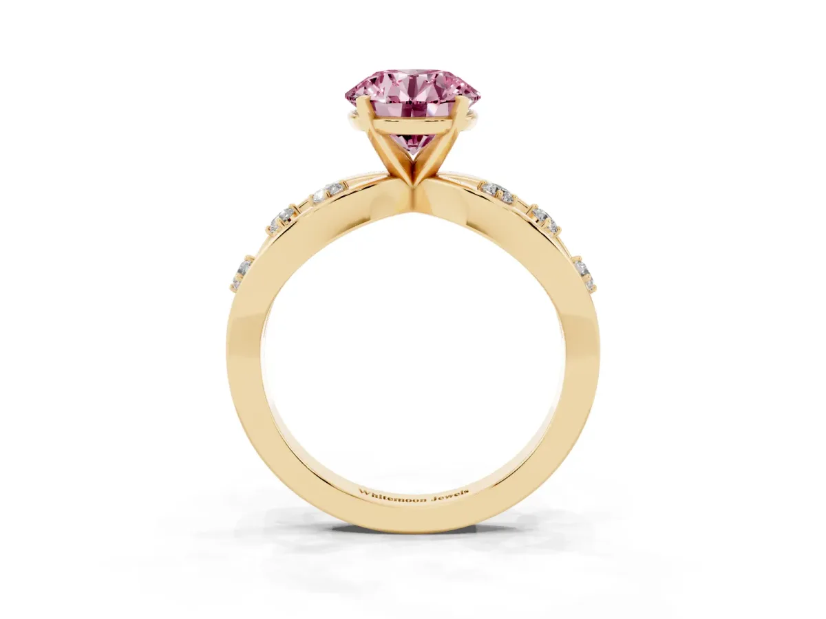Fancy Pink Round Cut Cut Solitaire Diamond with Side Stones on Criss-Cross Band and Four-Prong Setting Yellow gold