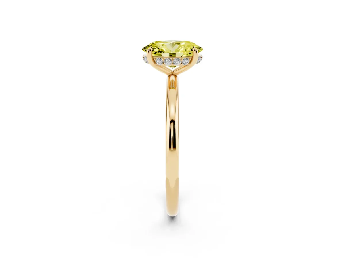 Fancy Yellow Oval Cut Solitaire Diamond Ring with a Classic Band and Four-Prong Setting Yellow gold