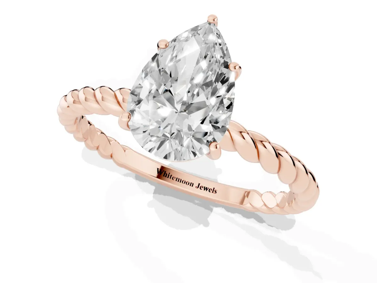 Pear Cut Solitaire Twist Band Ring with Four-Prong Setting Rose gold
