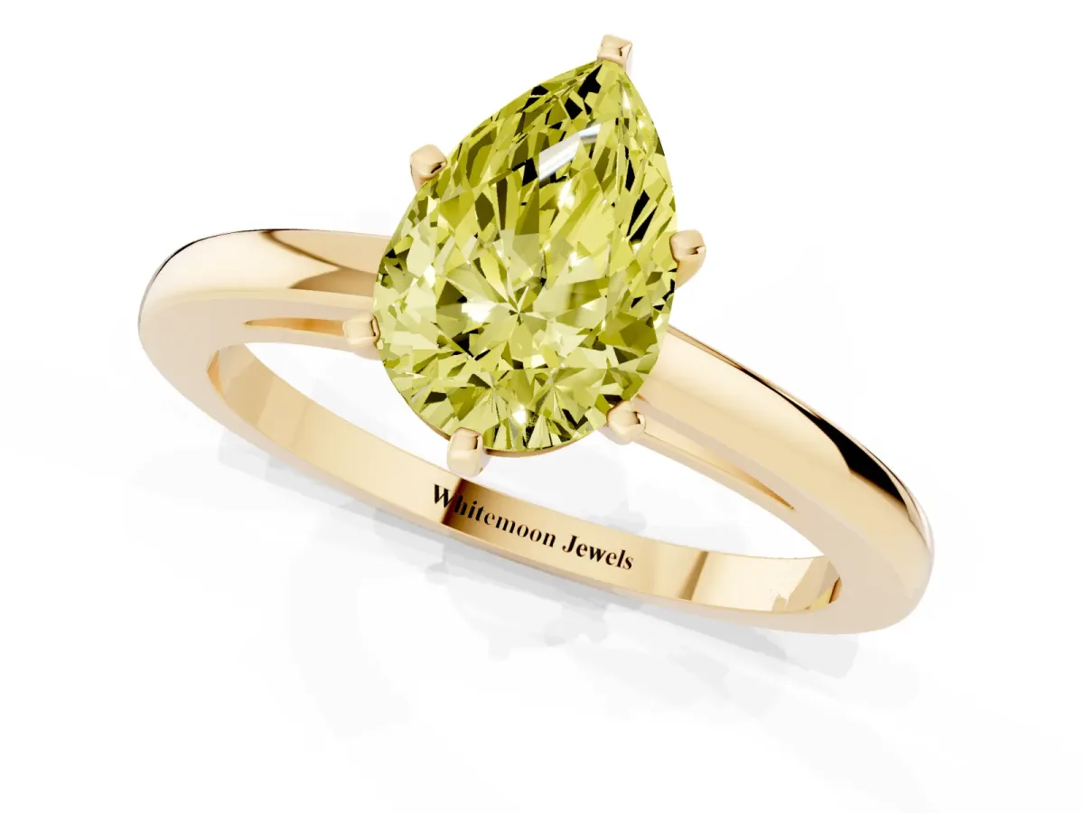 Fancy Yellow Pear Cut Solitaire Diamond Engagement Ring with Four-Prong Setting on a Classic Band Yellow gold