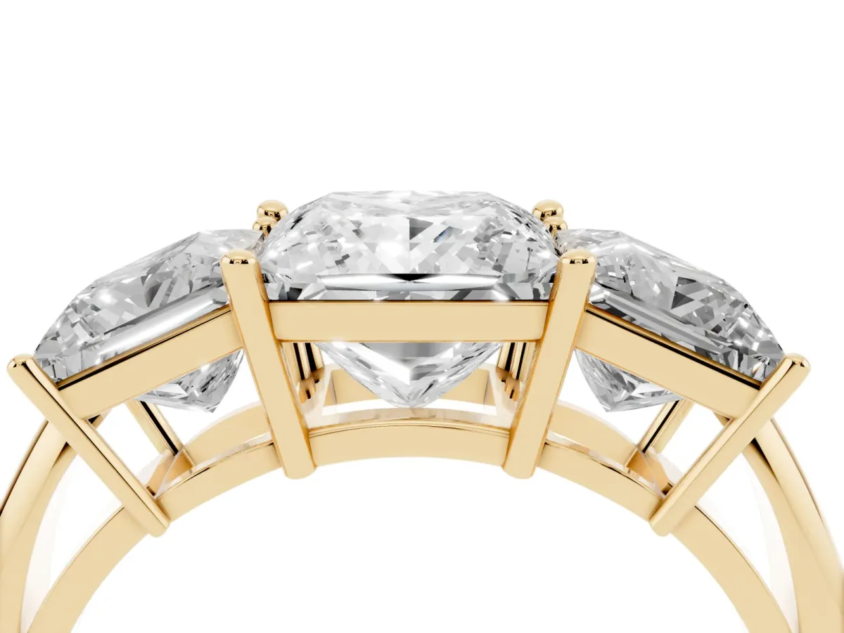 Three-Stone Princess Cut Cut Diamond Engagement Ring with Prong Setting on a White Gold Band Yellow gold