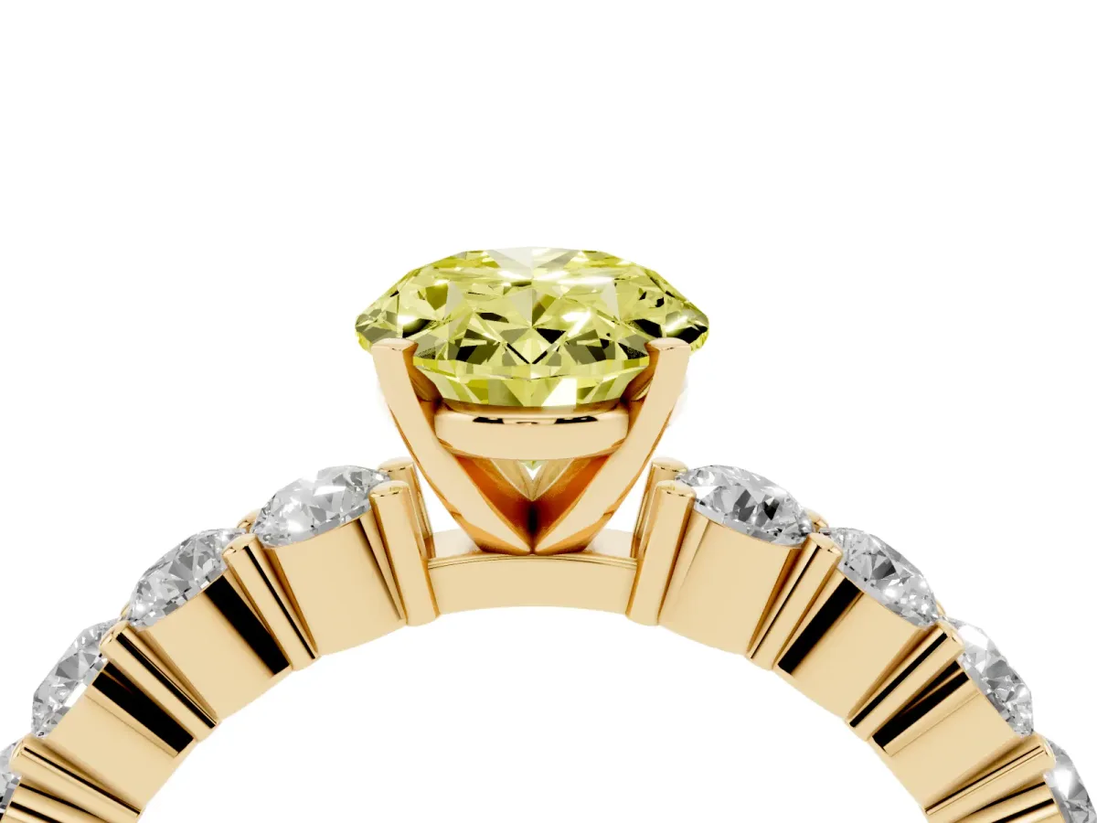 Fancy Yellow Oval Cut Diamond Solitaire Ring with Shared Prong Round Side Stones Yellow gold