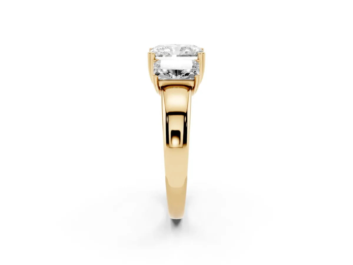 Three-Stone Radiant Cut Cut Diamond Ring with Channel Set Band and Four-Prong Setting Yellow gold