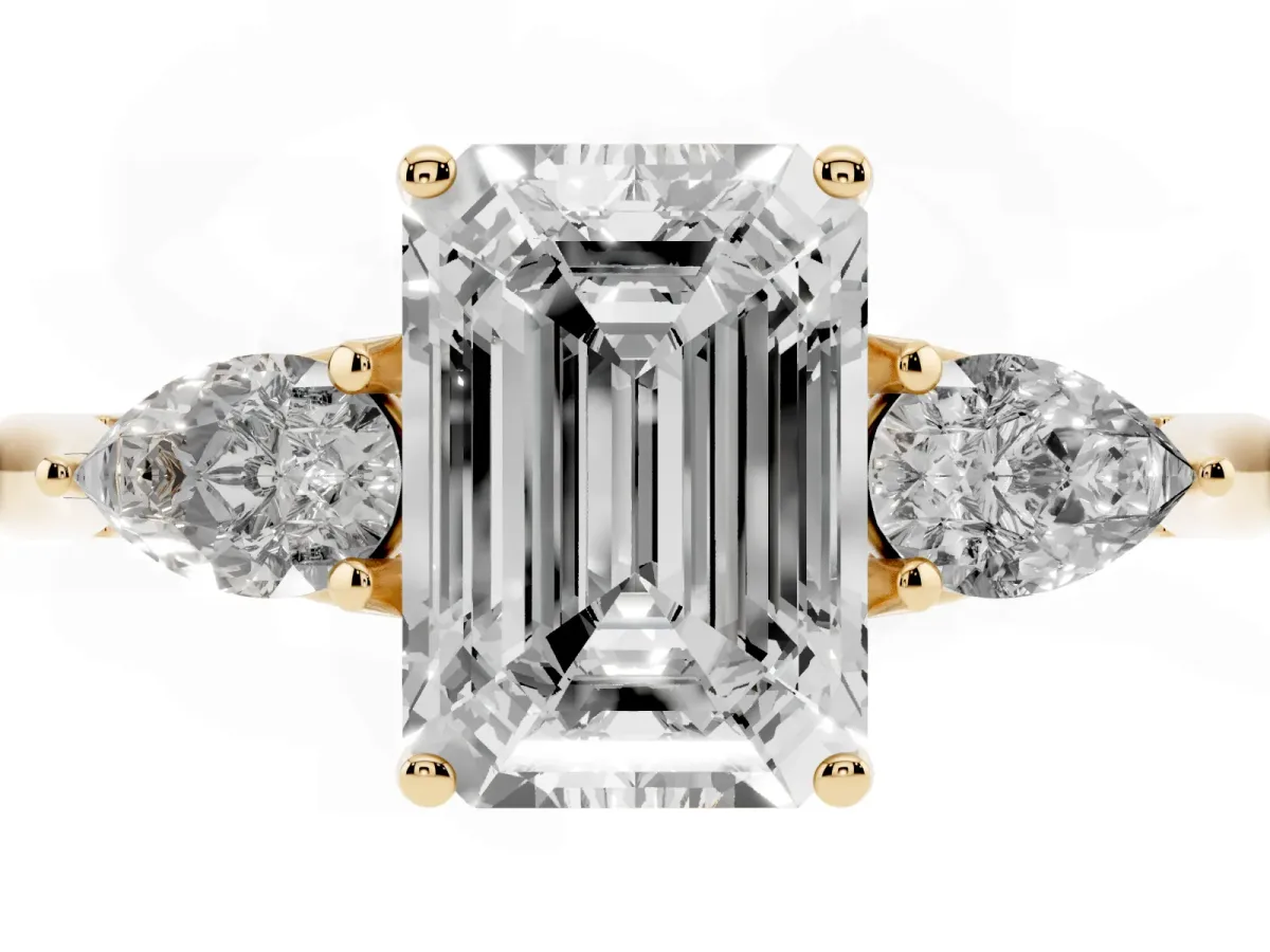 Three-Stone Emerald Cut Brilliant Diamond Solitaire Ring with Tapered Band and Four-Prong Setting Yellow gold