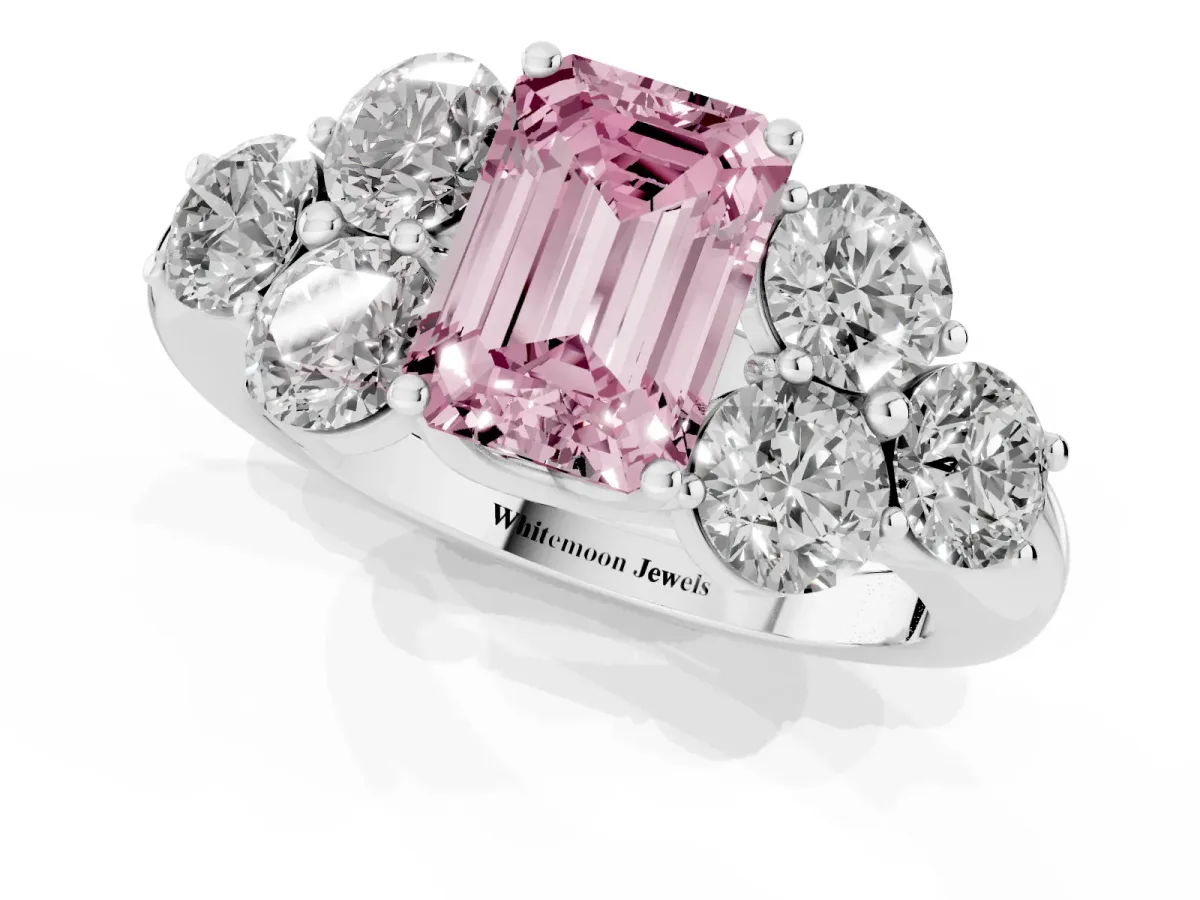 Fancy Pink Emerald Cut Cut Diamond Cluster Ring with Round Accent Stones and Prong Setting on a Classic Band Silver