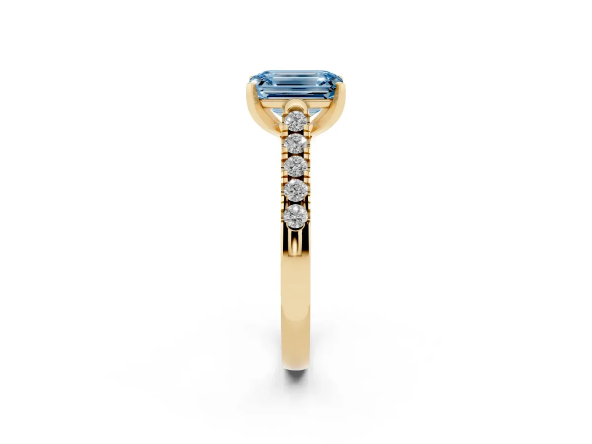 Fancy Blue Emerald Cut Diamond Pavé Band Solitaire Ring with Prong Setting Yellow gold