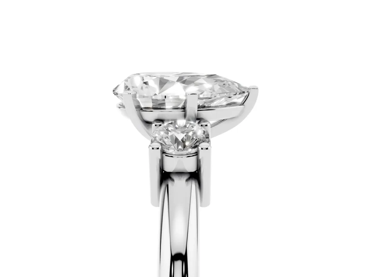 Three-Stone Pear Cut Cut Diamond Solitaire with Prong Setting and Classic Band Platinum