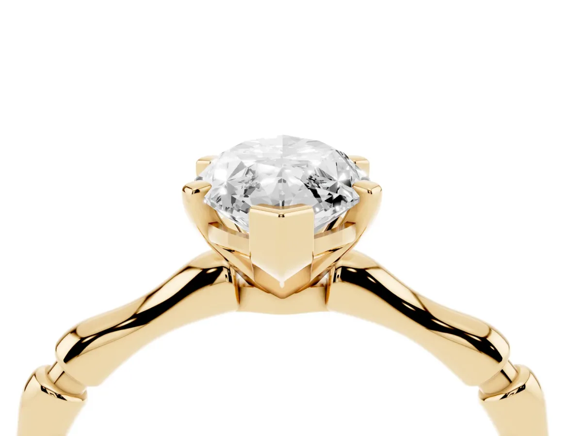 Marquise Cut Solitaire Diamond Ring with Bamboo Band and Four-Prong Setting Yellow gold