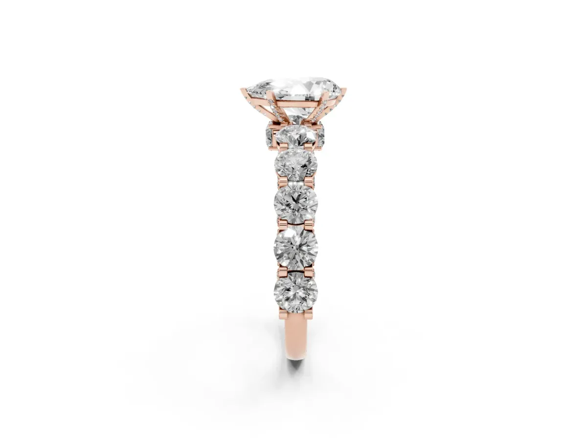 Pear Cut Diamond Side Stone Engagement Ring with Four-Prong Setting Rose gold