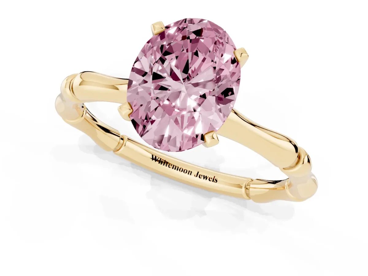 Fancy Pink Oval Cut Solitaire Diamond Ring with Bamboo Band and Four-Prong Setting Yellow gold