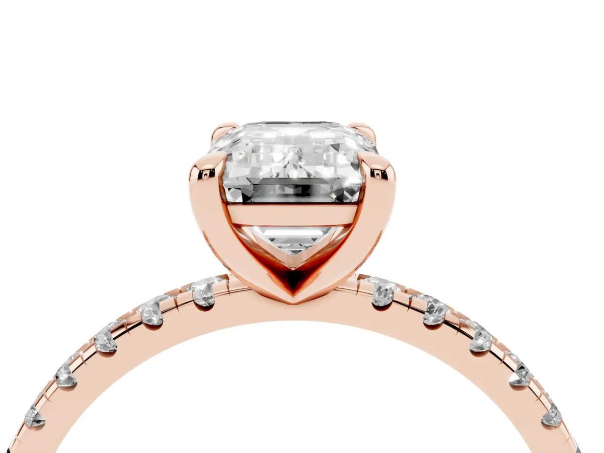 Emerald Cut Diamond Brilliant Solitaire Ring with Pavé Band and Four-Prong Setting Rose gold