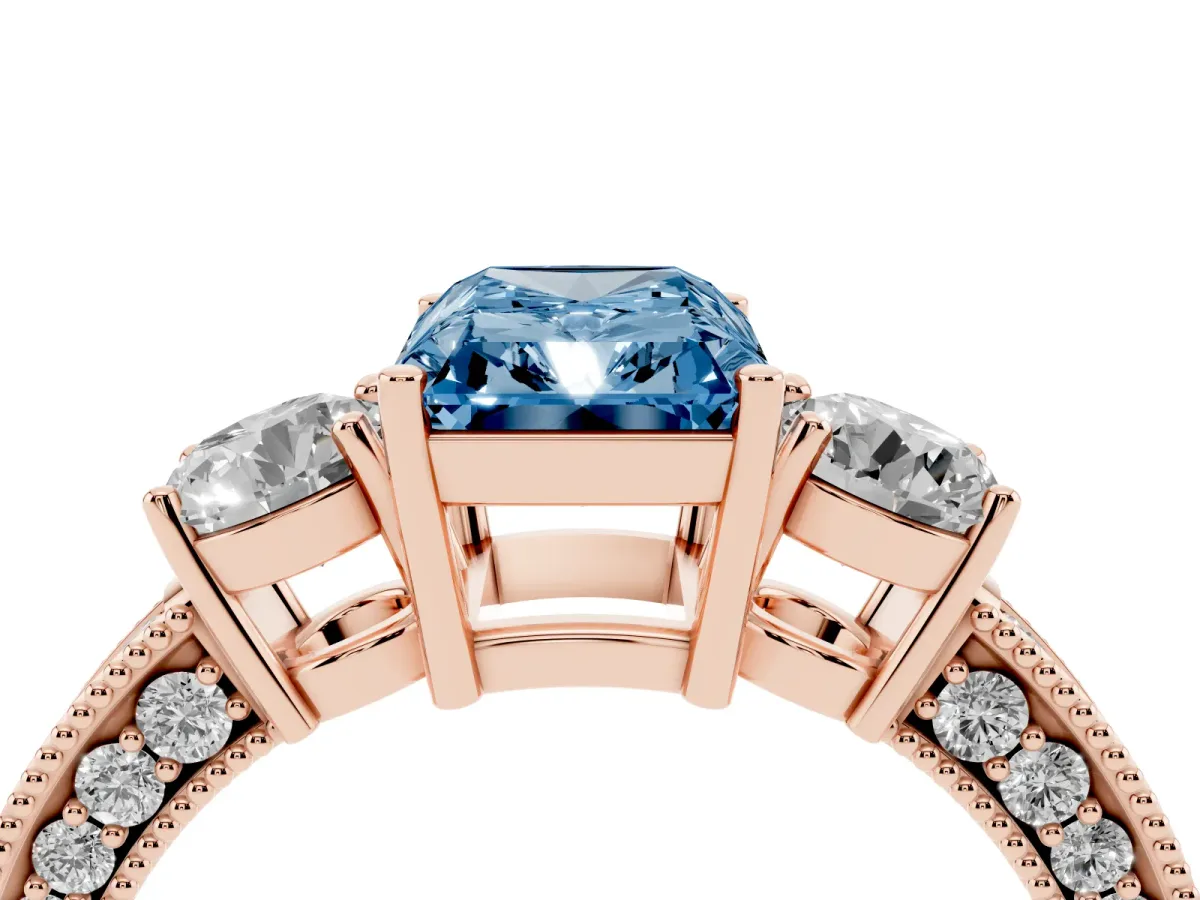 Fancy Blue Radiant Cut Three-Stone Diamond Ring with Pavé Band and Four-Prong Setting Rose gold