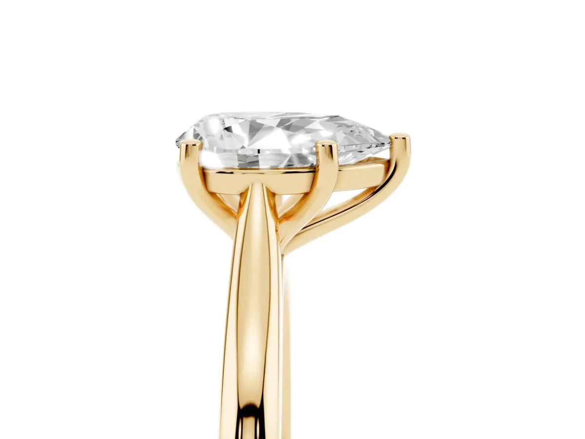 Pear Cut Cut Solitaire Ring with Cathedral Band and Four-Prong Setting Yellow gold