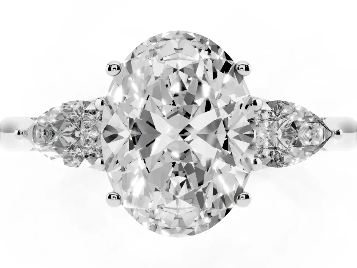 Three-Stone Oval Cut Diamond Ring with Pear Side Stones in Four-Prong Setting Platinum
