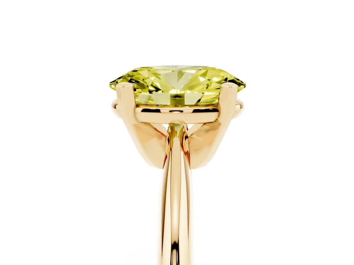 Fancy Yellow Oval Cut Cut Solitaire Ring with Four-Prong Setting on a Classic Band Yellow gold