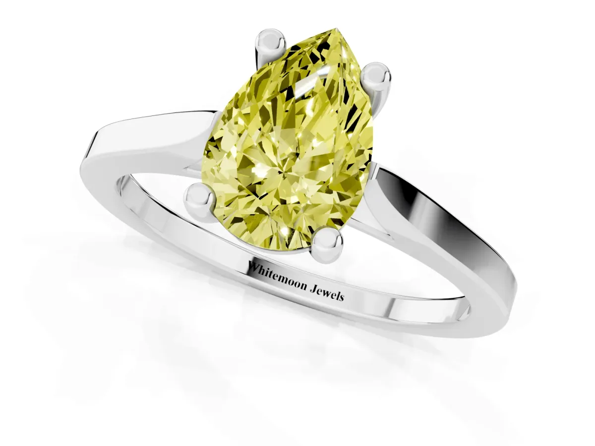 Fancy Yellow Pear Cut Solitaire Diamond Ring with Four-Prong Setting and Tapered Band White gold