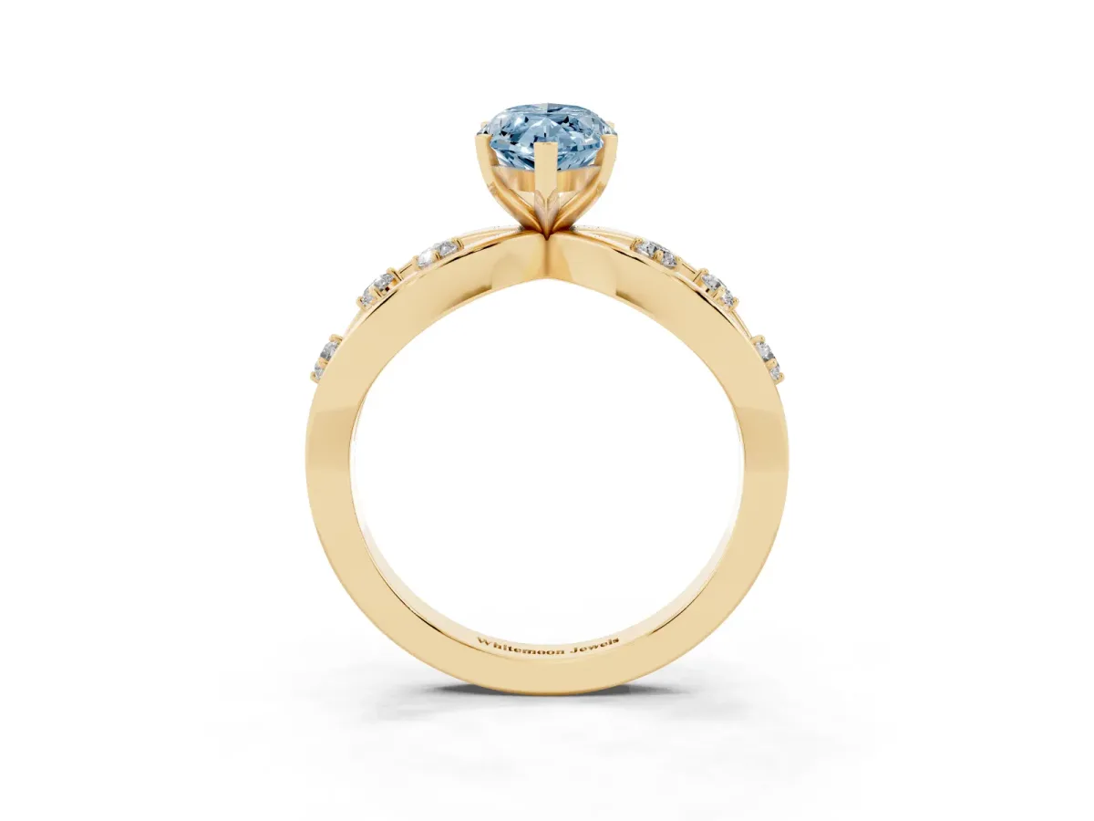 Fancy Blue Marquise Cut Cut Solitaire Diamond with Side Stones on Criss-Cross Band and Four-Prong Setting Yellow gold