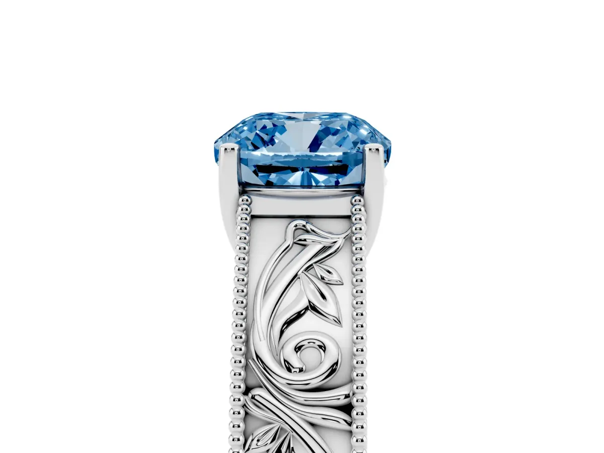 Fancy Blue Cushion Cut Diamond Solitaire Ring with Engraved Band and Four-Prong Setting Platinum