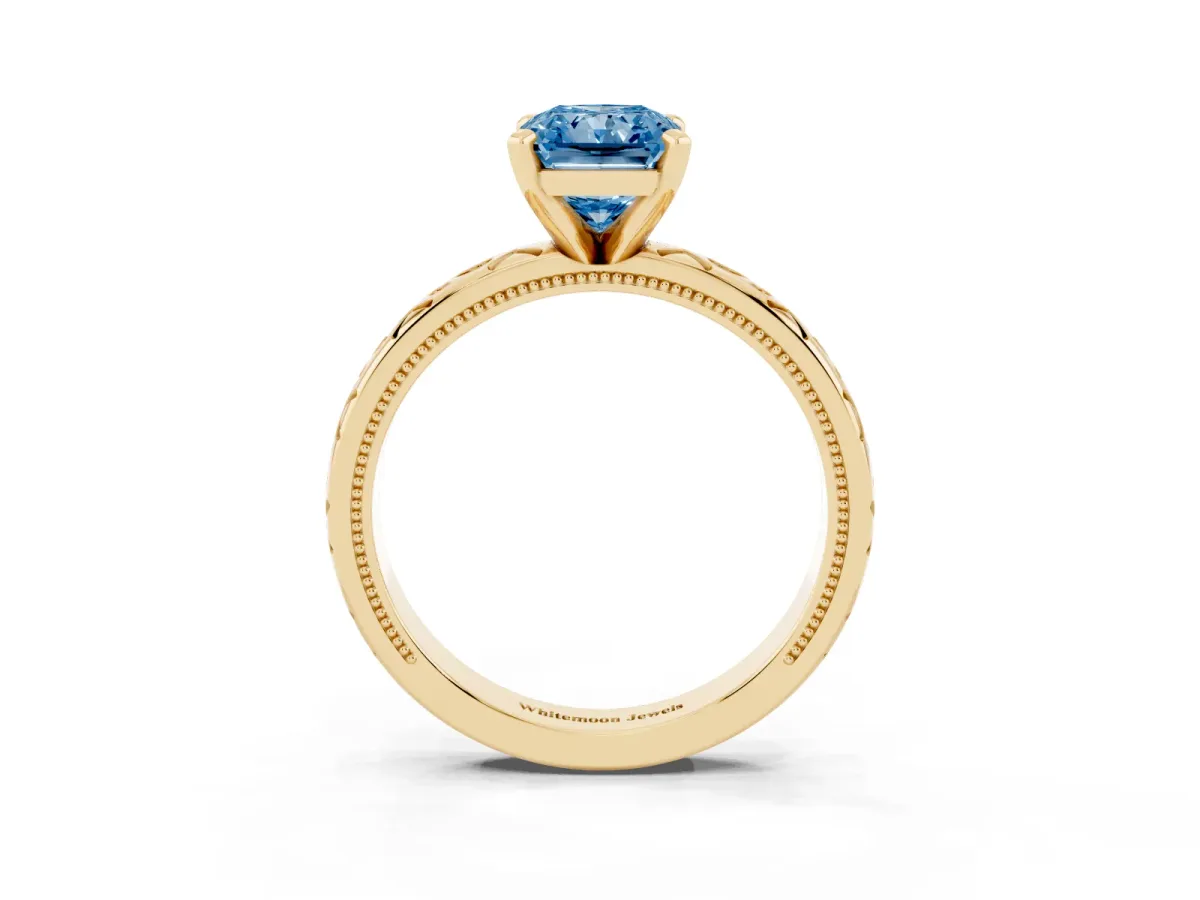 Fancy Blue Radiant Cut Solitaire Engagement Ring with Scrollwork Band and Four-Prong Setting Yellow gold