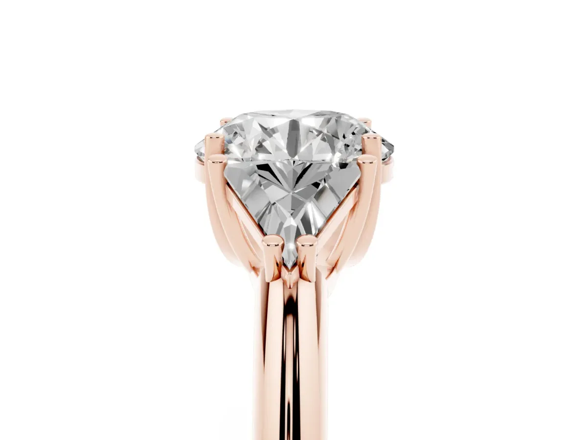 Three-Stone Round Cut Diamond Engagement Ring with Trillion Side Stones and Prong Setting Rose gold