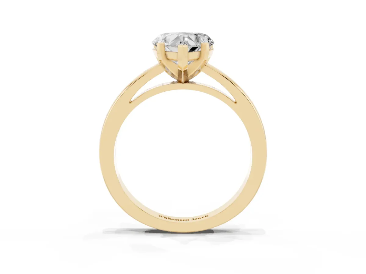 Heart Cut Solitaire Diamond Engagement Ring with Four-Prong Setting on a Classic Band Yellow gold