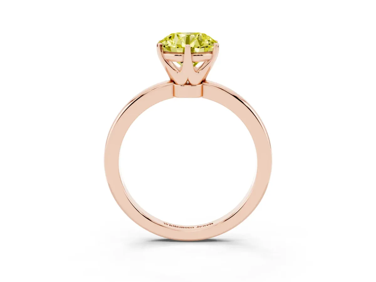 Fancy Yellow Round Cut Solitaire Diamond Ring with Six-Prong Setting on a Classic Band Rose gold