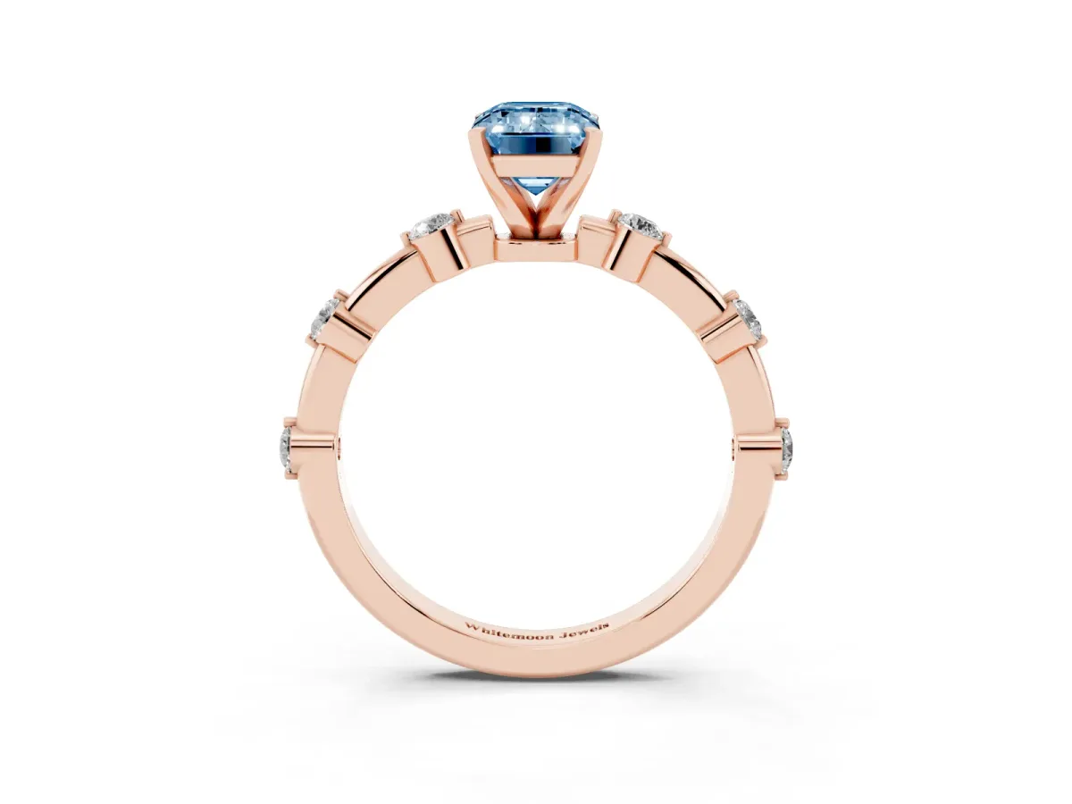 Fancy Blue Emerald Cut Solitaire Diamond Ring with Bezel Set Side Stones and Prong Setting Rose gold